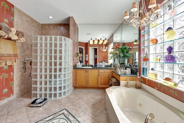 full bathroom featuring a walk in shower, a jetted tub, vanity, a chandelier, and tile patterned flooring