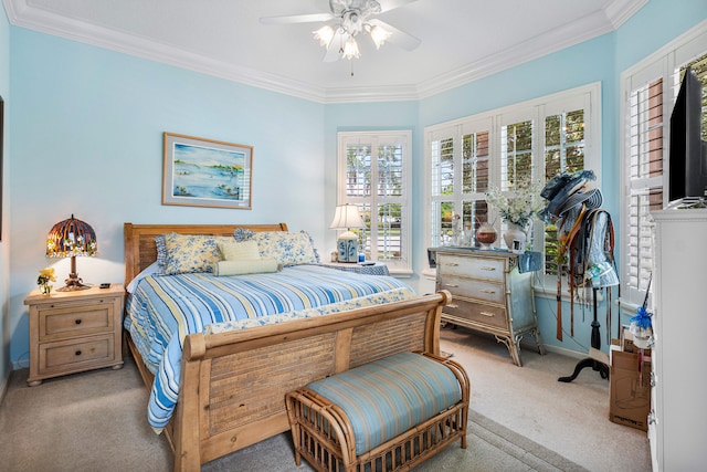 carpeted bedroom with crown molding and ceiling fan