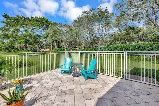 view of patio with view of wooded area