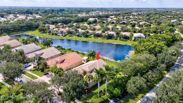 aerial view of residential area featuring a nearby body of water