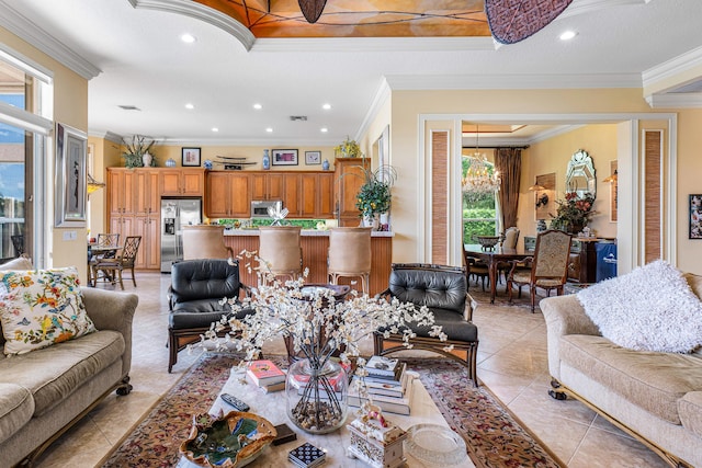 living area with light tile patterned flooring, ornamental molding, and recessed lighting
