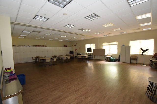 misc room featuring wood finished floors and a paneled ceiling