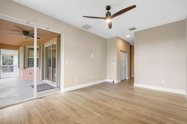 empty room with light wood-type flooring and ceiling fan