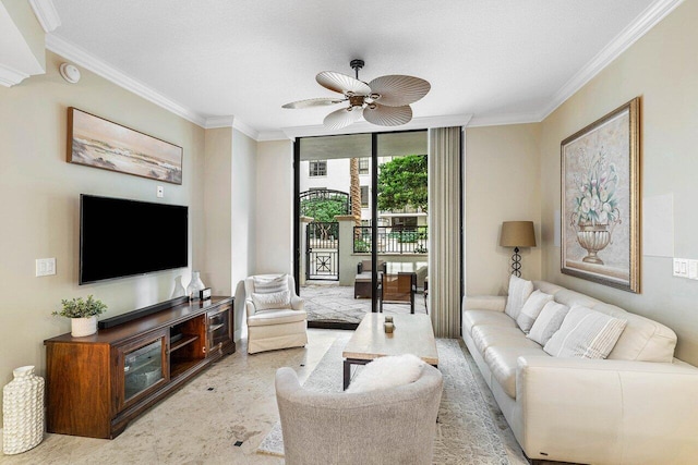 living room featuring ceiling fan, a textured ceiling, and ornamental molding