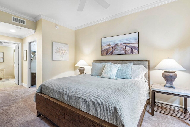 carpeted bedroom with ensuite bathroom, ceiling fan, and ornamental molding