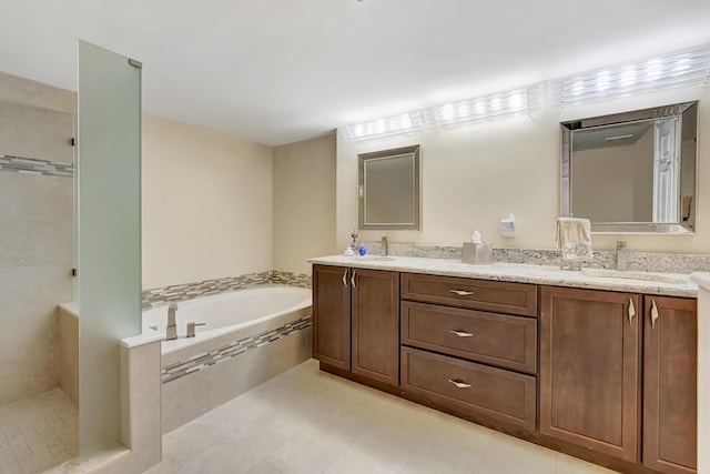 bathroom with vanity, shower with separate bathtub, and tile patterned floors