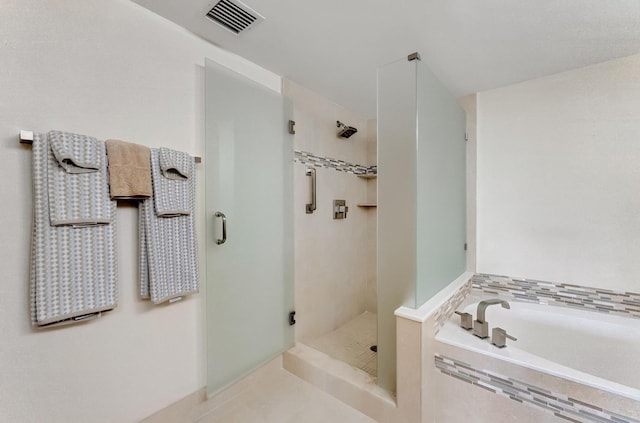 bathroom featuring independent shower and bath and tile patterned floors