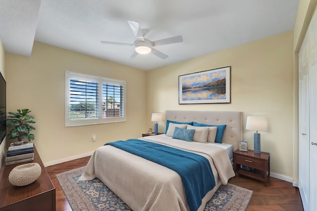 bedroom with a closet, ceiling fan, and dark wood-type flooring