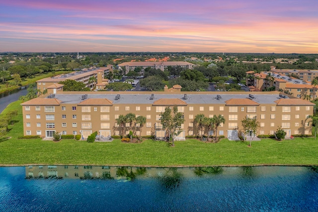 aerial view at dusk with a water view