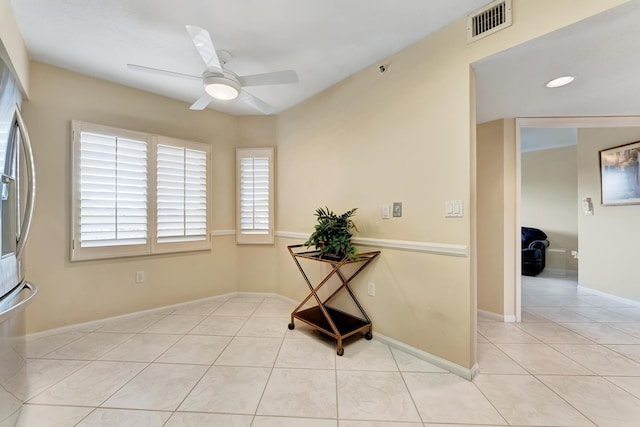 interior space featuring ceiling fan and light tile patterned flooring