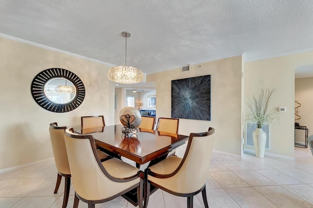 dining area featuring a notable chandelier, ornamental molding, light tile patterned floors, and a textured ceiling