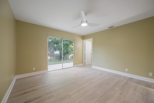 spare room with light wood-type flooring and ceiling fan