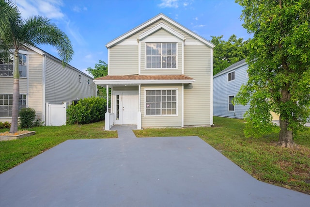 back of house featuring a yard