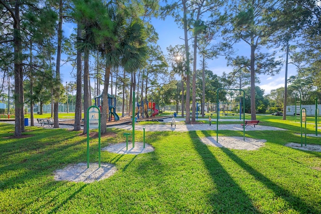 view of home's community featuring a playground and a lawn