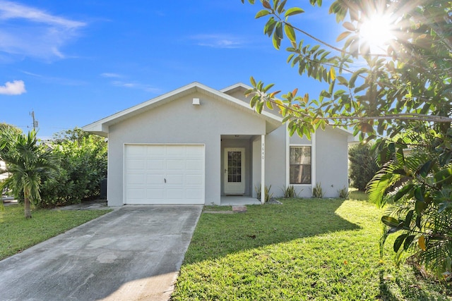 ranch-style house featuring a front lawn and a garage