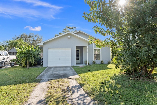 ranch-style house featuring a garage and a front lawn