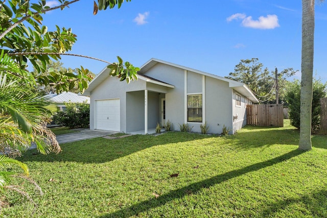 single story home with a front yard and a garage