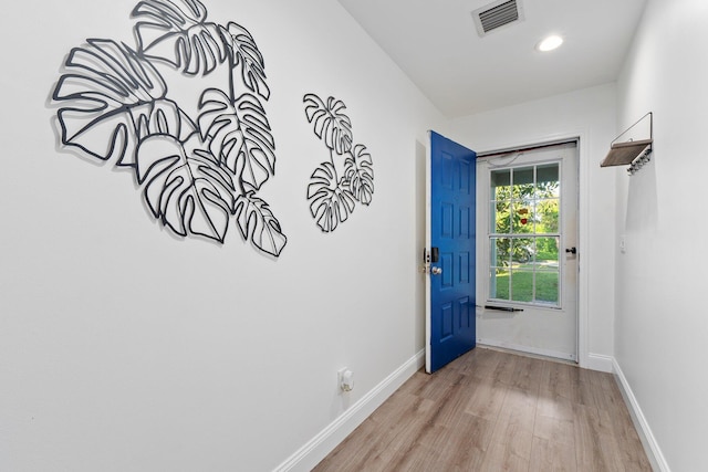 doorway with light hardwood / wood-style flooring