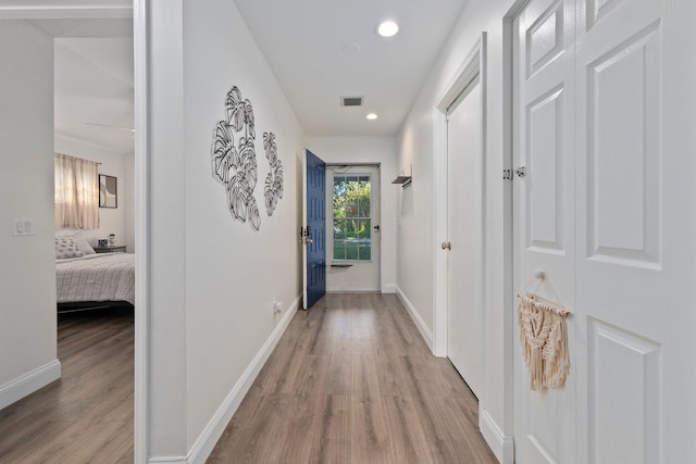 corridor featuring light wood-type flooring