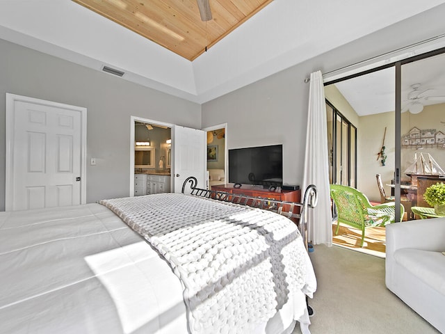 carpeted bedroom with connected bathroom, wood ceiling, and ceiling fan