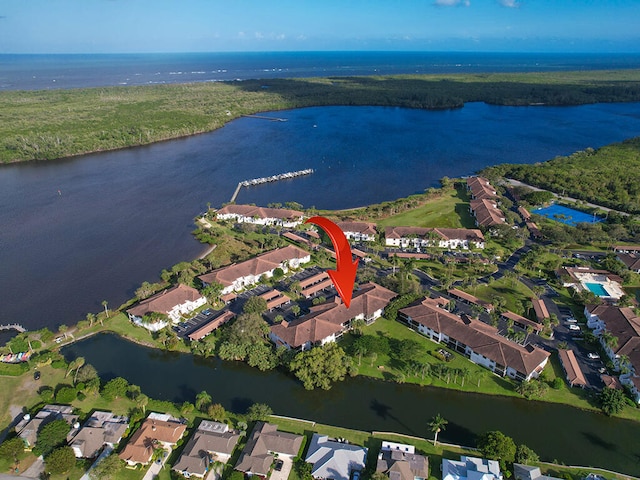 birds eye view of property featuring a water view