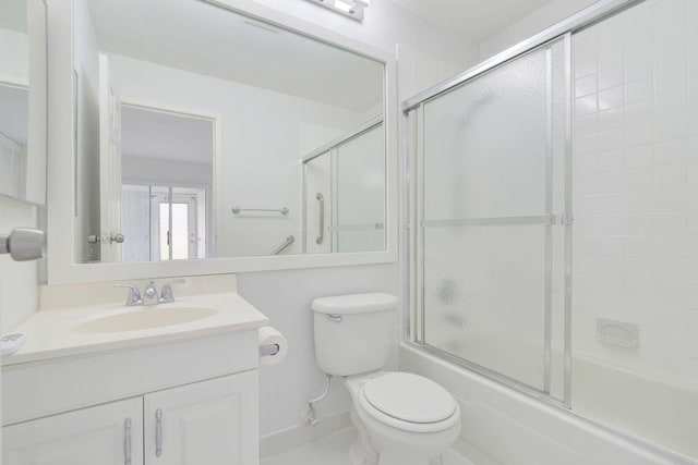 full bathroom with toilet, vanity, and shower / bath combination with glass door