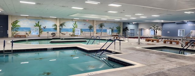 view of swimming pool featuring an indoor in ground hot tub