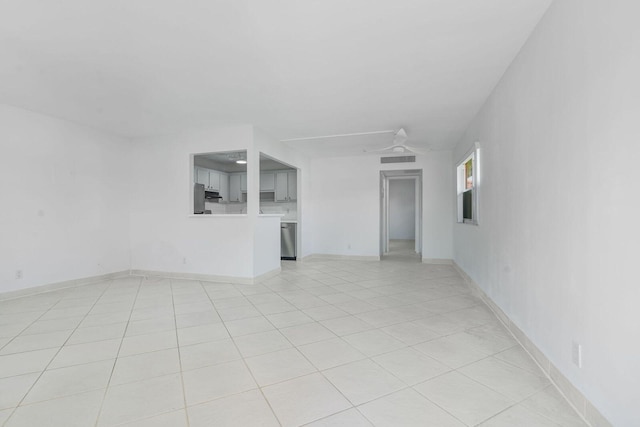 unfurnished living room featuring ceiling fan and light tile patterned floors