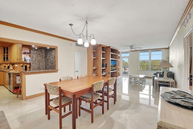 dining area featuring crown molding, a textured ceiling, and ceiling fan with notable chandelier