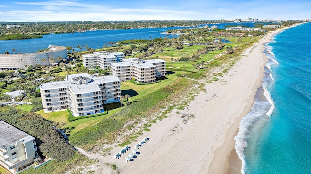 aerial view with a water view and a beach view