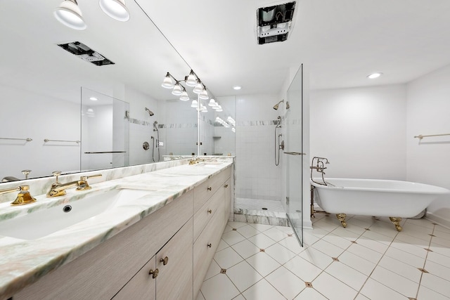 bathroom with tile patterned flooring, vanity, and shower with separate bathtub