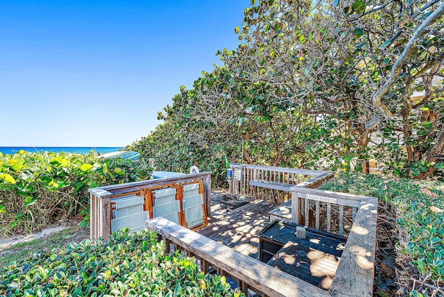 wooden terrace with a water view