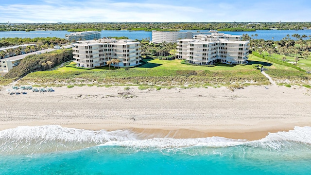 drone / aerial view with a view of the beach and a water view