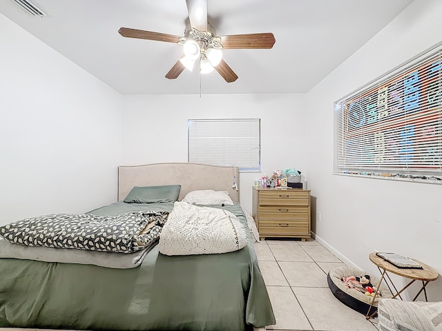 bedroom featuring ceiling fan and light tile patterned flooring