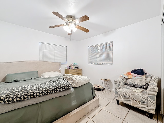 bedroom featuring light tile patterned floors and ceiling fan