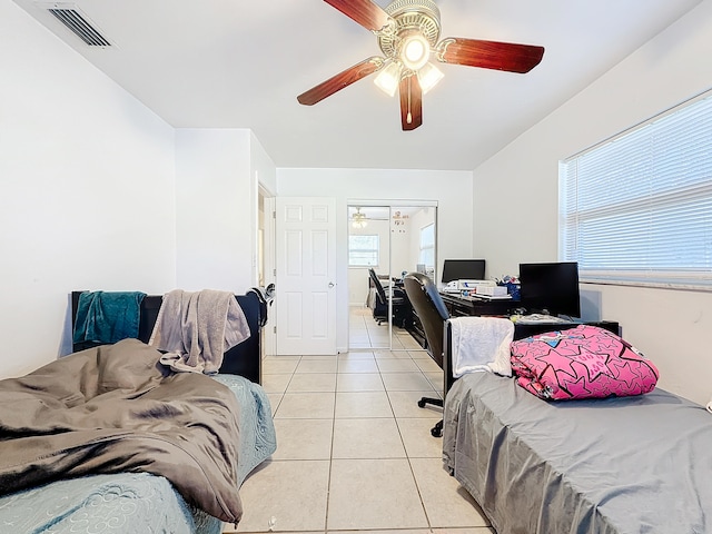 bedroom featuring ceiling fan and light tile patterned floors