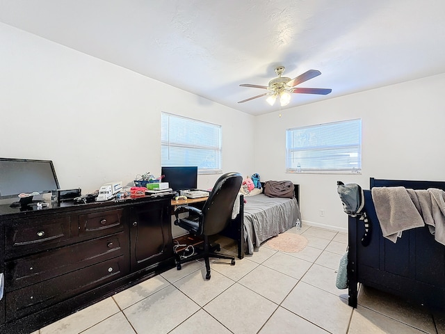 tiled bedroom featuring ceiling fan