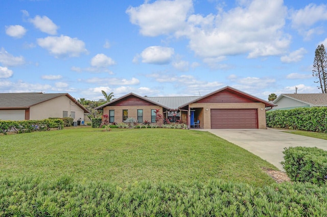 ranch-style house with a garage and a front yard