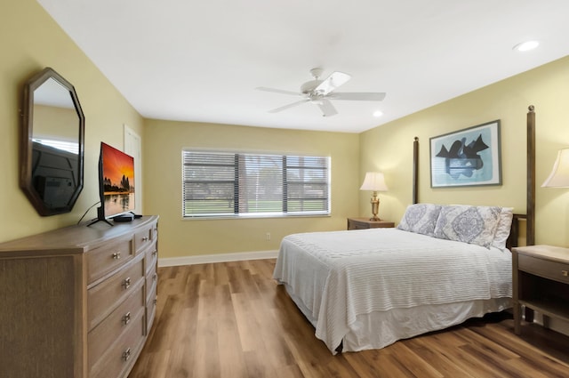 bedroom featuring ceiling fan and light hardwood / wood-style flooring