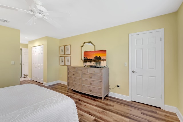 bedroom with ceiling fan and light hardwood / wood-style flooring