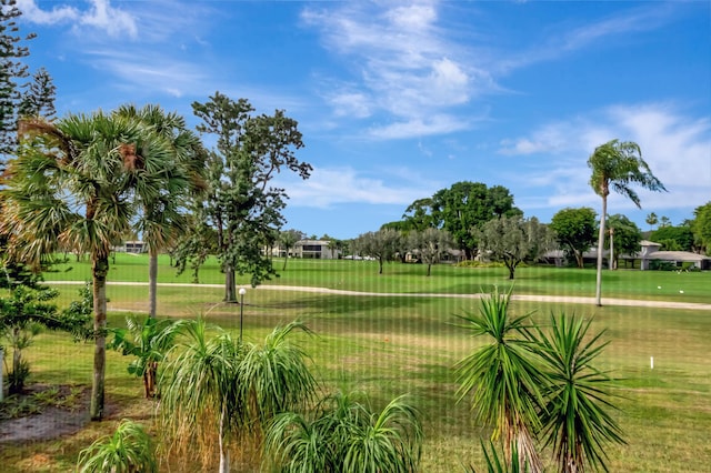 view of property's community featuring a yard