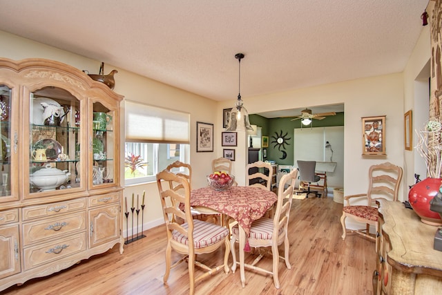 6357 Stanley Ln, Delray Beach, FL 33484 - dining space with light wood-style floors, ceiling fan, a textured ceiling, and baseboards