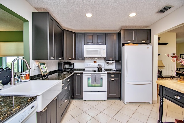6357 Stanley Ln, Delray Beach, FL 33484 - kitchen with white appliances, a sink, a textured ceiling, backsplash, and recessed lighting