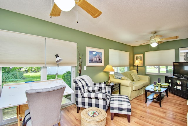 6357 Stanley Ln, Delray Beach, FL 33484 - living area with ceiling fan, wood finished floors, and a textured ceiling