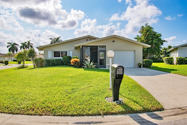 ranch-style home with a front lawn and a garage