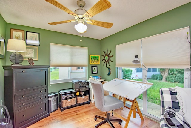 office area with ceiling fan and light wood-type flooring