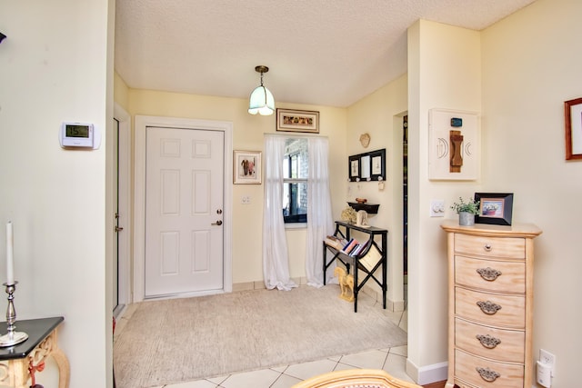 6357 Stanley Ln, Delray Beach, FL 33484 - entrance foyer featuring light carpet, light tile patterned floors, and a textured ceiling