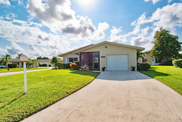 ranch-style house featuring a garage and a front lawn