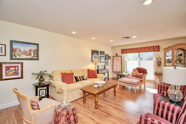 6357 Stanley Ln, Delray Beach, FL 33484 - living room featuring light wood finished floors, recessed lighting, baseboards, and a textured ceiling