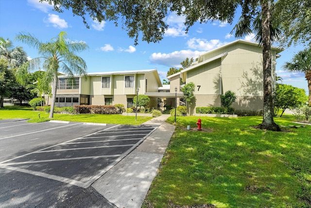 800 NW Fork Rd Unit 7-3, Stuart, FL 34994 - view of building exterior with uncovered parking